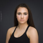 confidence, confident headshot, connection, head shot, headshot, performer headshot, spotlight headshot, spotlight profile image, strong headshot, studio headshot