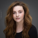 confidence, confident headshot, connection, head shot, headshot, performer headshot, spotlight headshot, spotlight profile image, strong headshot, studio headshot, vocalist headshot