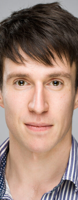 Juan Barton, confidence, confident headshot, connection, dancer, head shot, headshot, male dancer, performer headshot, spotlight headshot, spotlight profile image, strong headshot, studio headshot