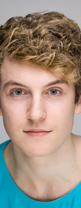Lyall Reece Nelis, confidence, confident headshot, connection, head shot, headshot, performer headshot, singer, spotlight headshot, spotlight profile image, strong headshot, studio headshot, vocalist