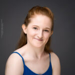 confidence, confident headshot, connection, head shot, headshot, performer headshot, spotlight headshot, spotlight profile image, strong headshot, studio headshot