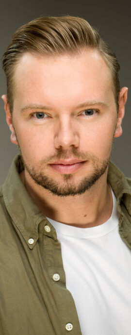SL Talent, Stephen Dillon, confidence, confident headshot, connection, head shot, headshot, performer headshot, spotlight headshot, spotlight profile image, strong headshot, studio headshot, vocalist headshot