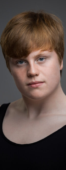confidence, confident headshot, connection, dancer, dancer headshot, dancer portfolio, head shot, headshot, male dancer, performer headshot, spotlight headshot, spotlight profile image, strong headshot, studio headshot